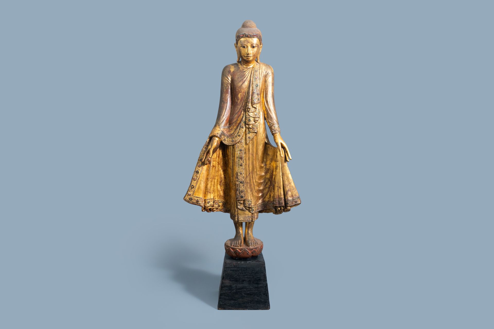 A tall inlaid gilt wood figure of a standing Buddha, Burma or Thailand, 19th/20th C.