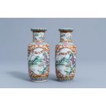 A pair of Chinese famille rose vases with animated river landscapes, 19th C.