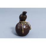 A Japanese bronze double gourd shaped vase with a bow, signed Jo Un, Meiji/Taisho, first half of the