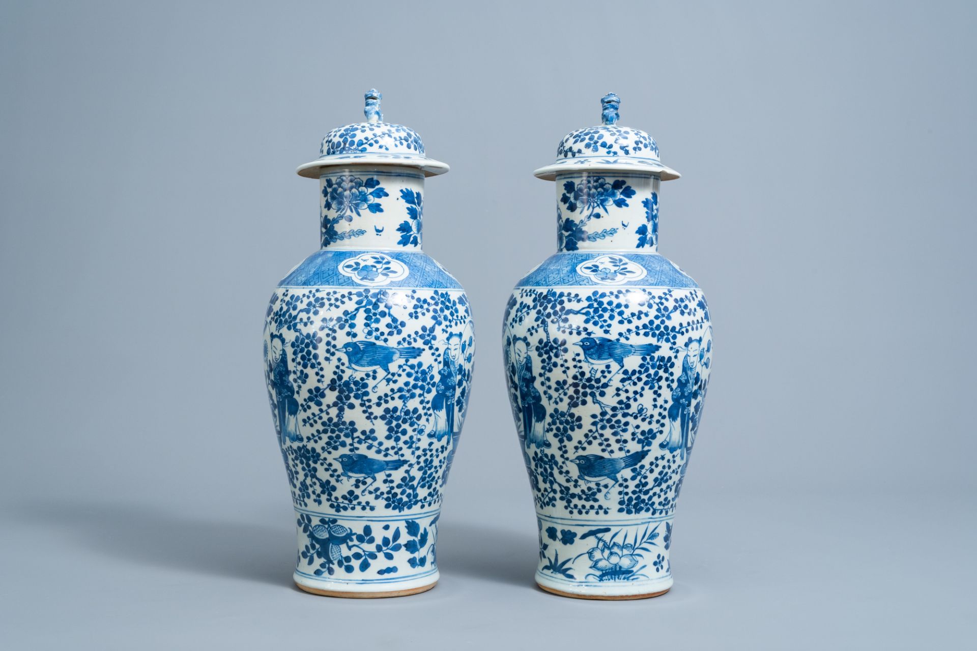 A pair of Chinese blue and white vases and covers with boys and antiquities, 19th C. - Image 2 of 6