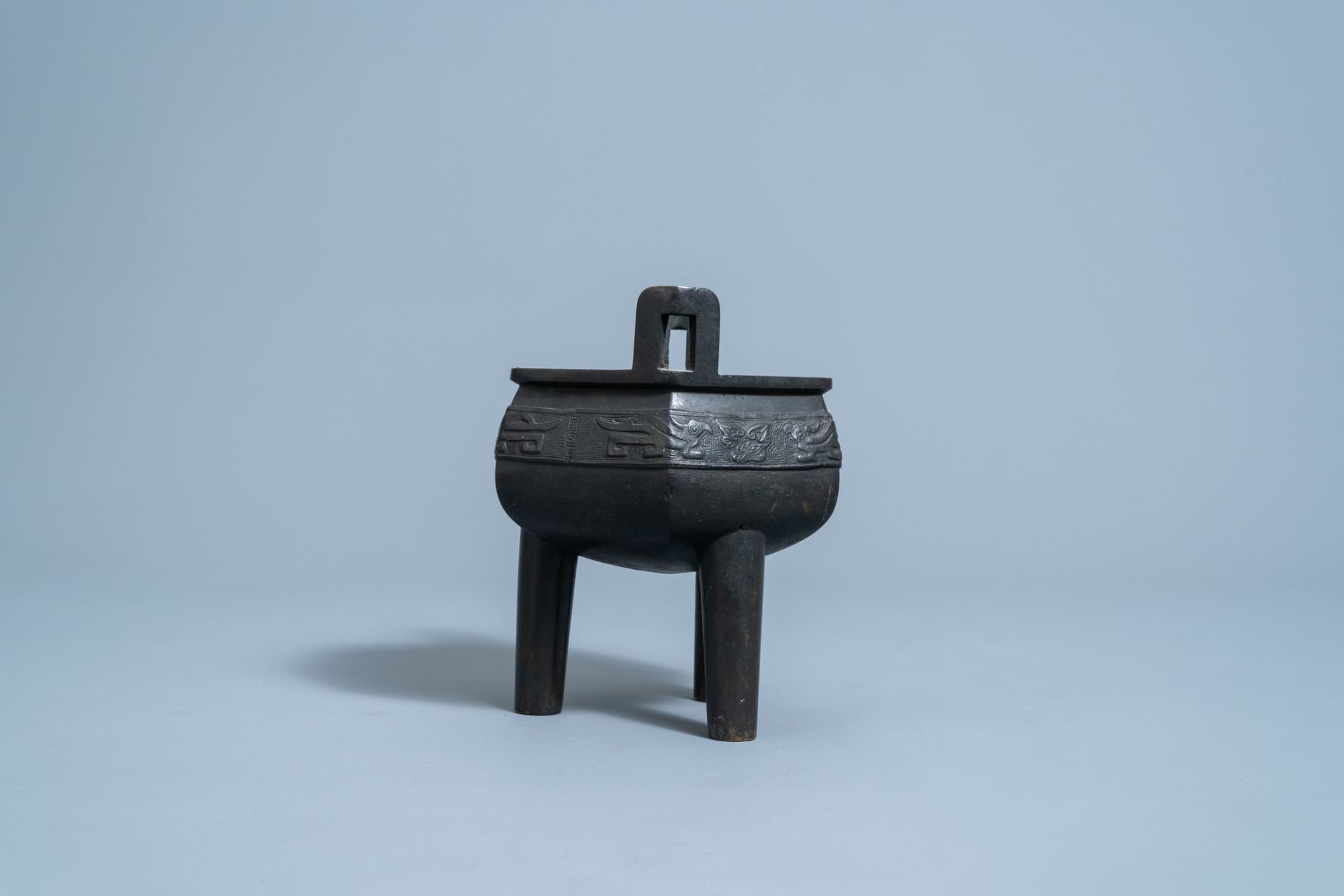 A Chinese bronze tripod censer with wooden cover and stand, Ming - Image 5 of 7
