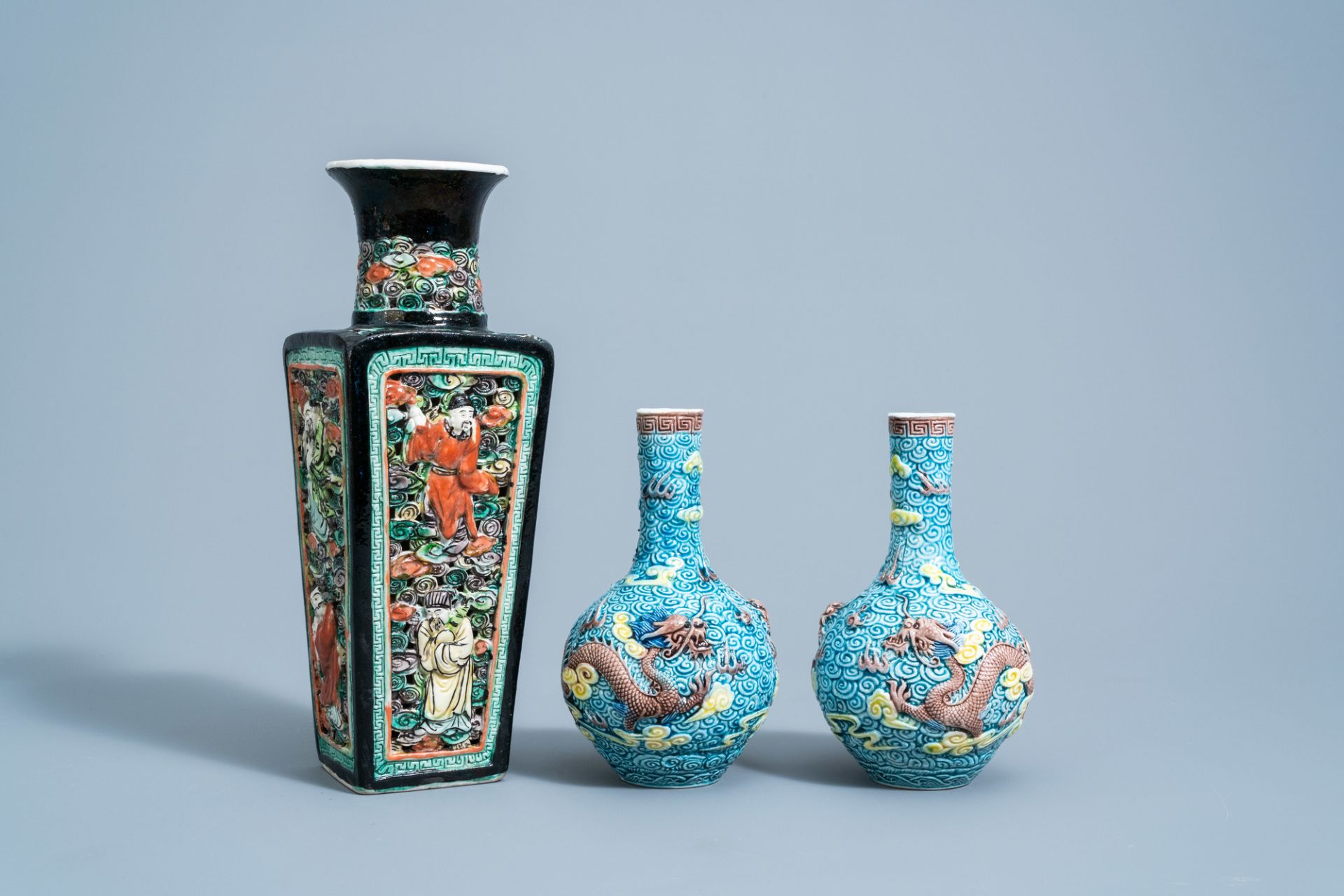 A pair of Chinese polychrome 'dragon' vases and a quadrangular 'Immortals' vase, 19th/20th C.