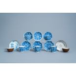 Seven Chinese blue, white and famille rose cups and saucers with floral design, Kangxi/Qianlong