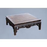 An rectangular Chinese carved wooden coffee table with glass top, 19th/20th C.
