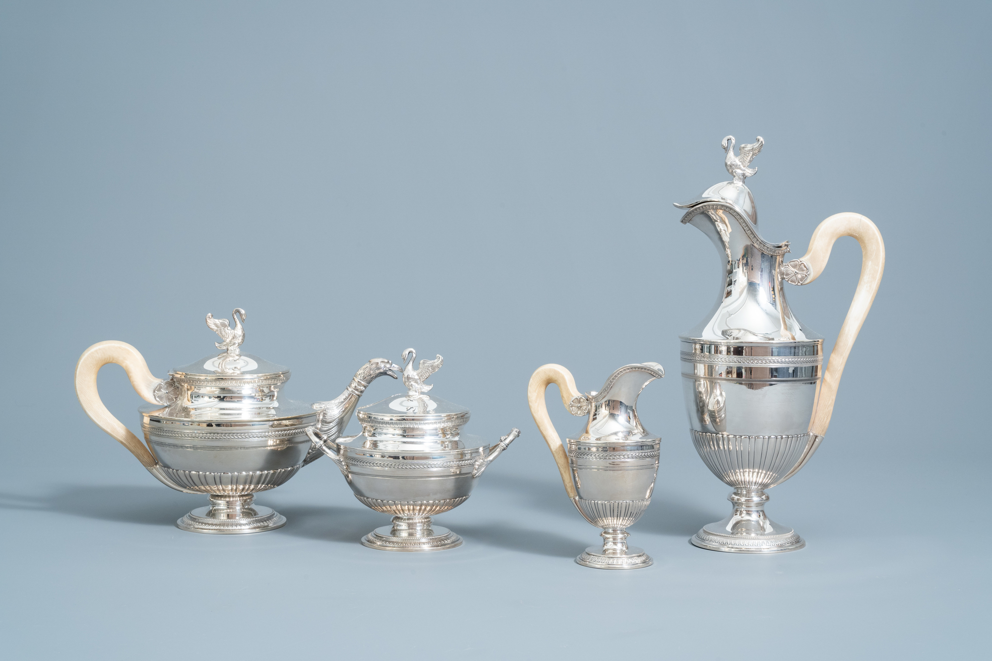 A four-piece silver Directoire style tea set with ivory handles, 800/000, 19th/20th C.