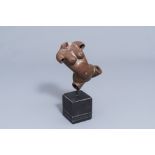 An Indian patinated copper fertility figure with text, 20th C.