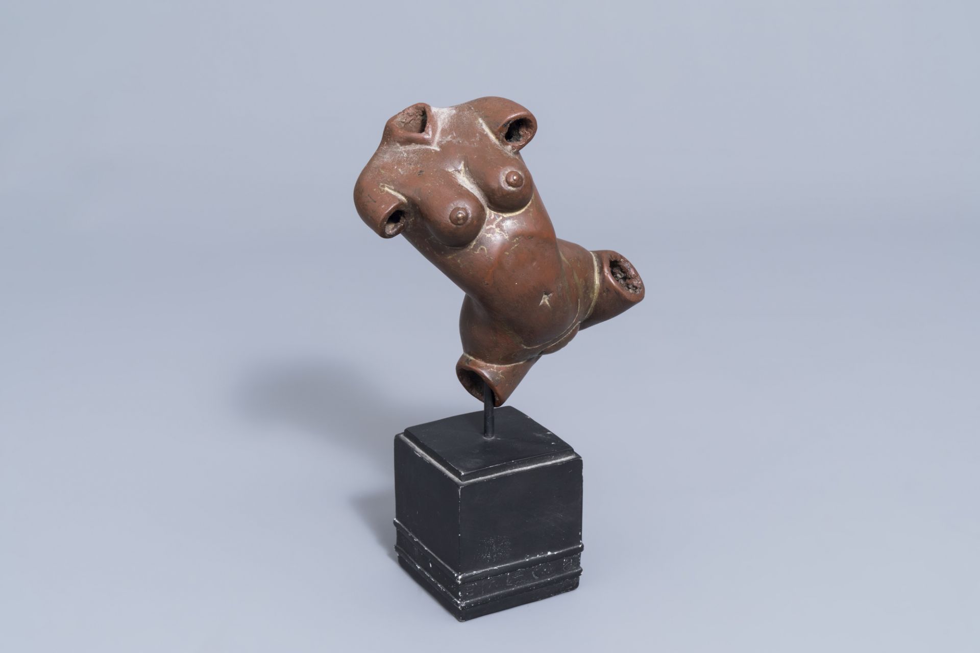 An Indian patinated copper fertility figure with text, 20th C.