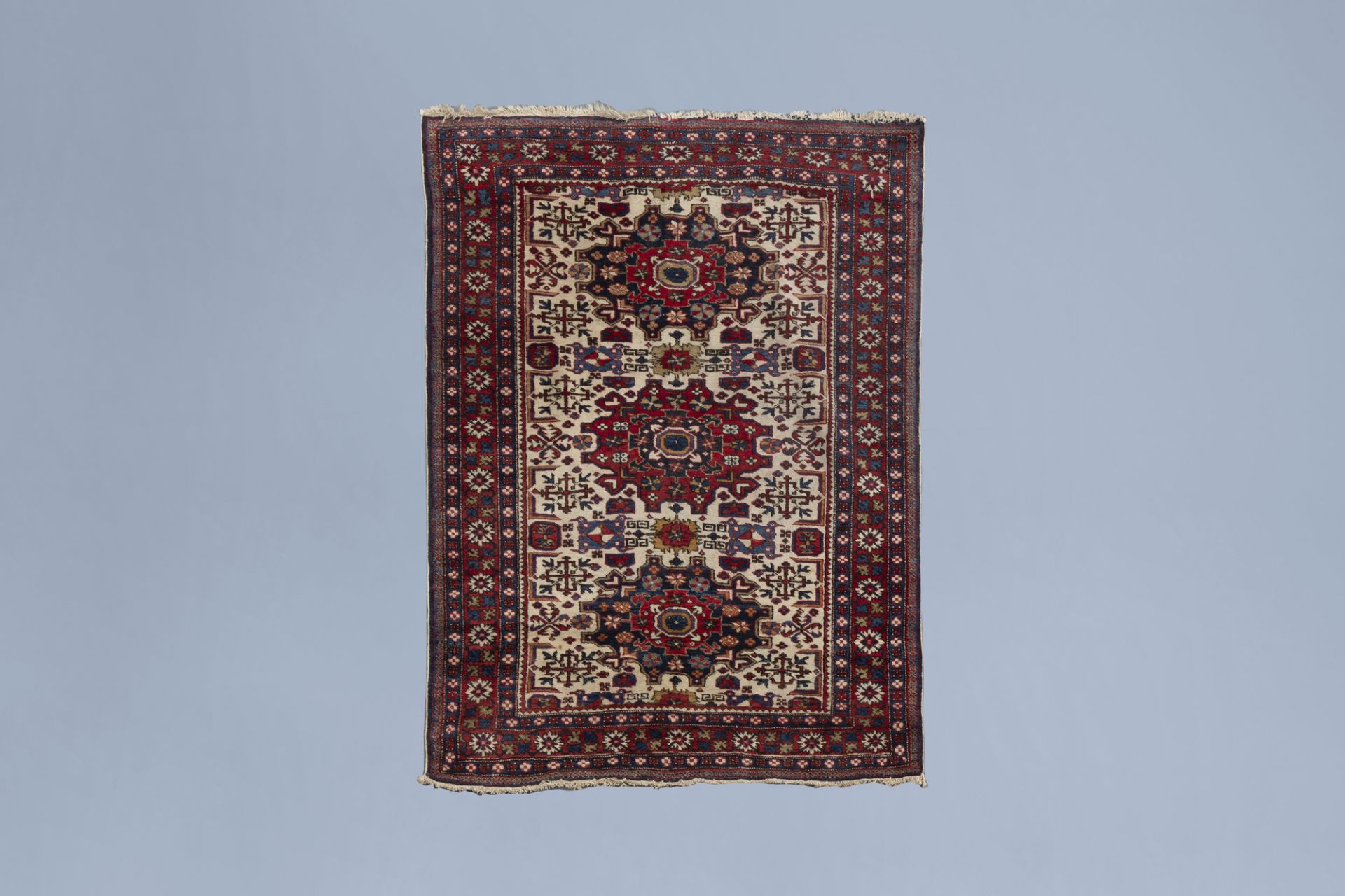 A Turkish rug with floral design, wool on cotton, mid 20th C.