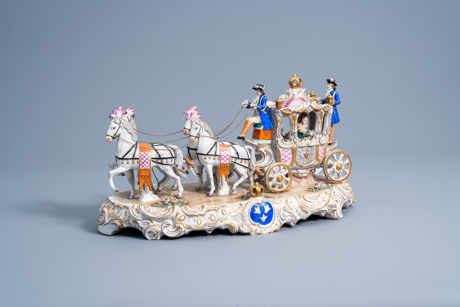 A group with a four-in-hand carriage in polychrome decorated Saxon porcelain, Sitzendorf mark, 20th