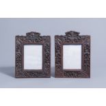 A pair of Chinese carved wooden frames with animals and flowers, 19th C.