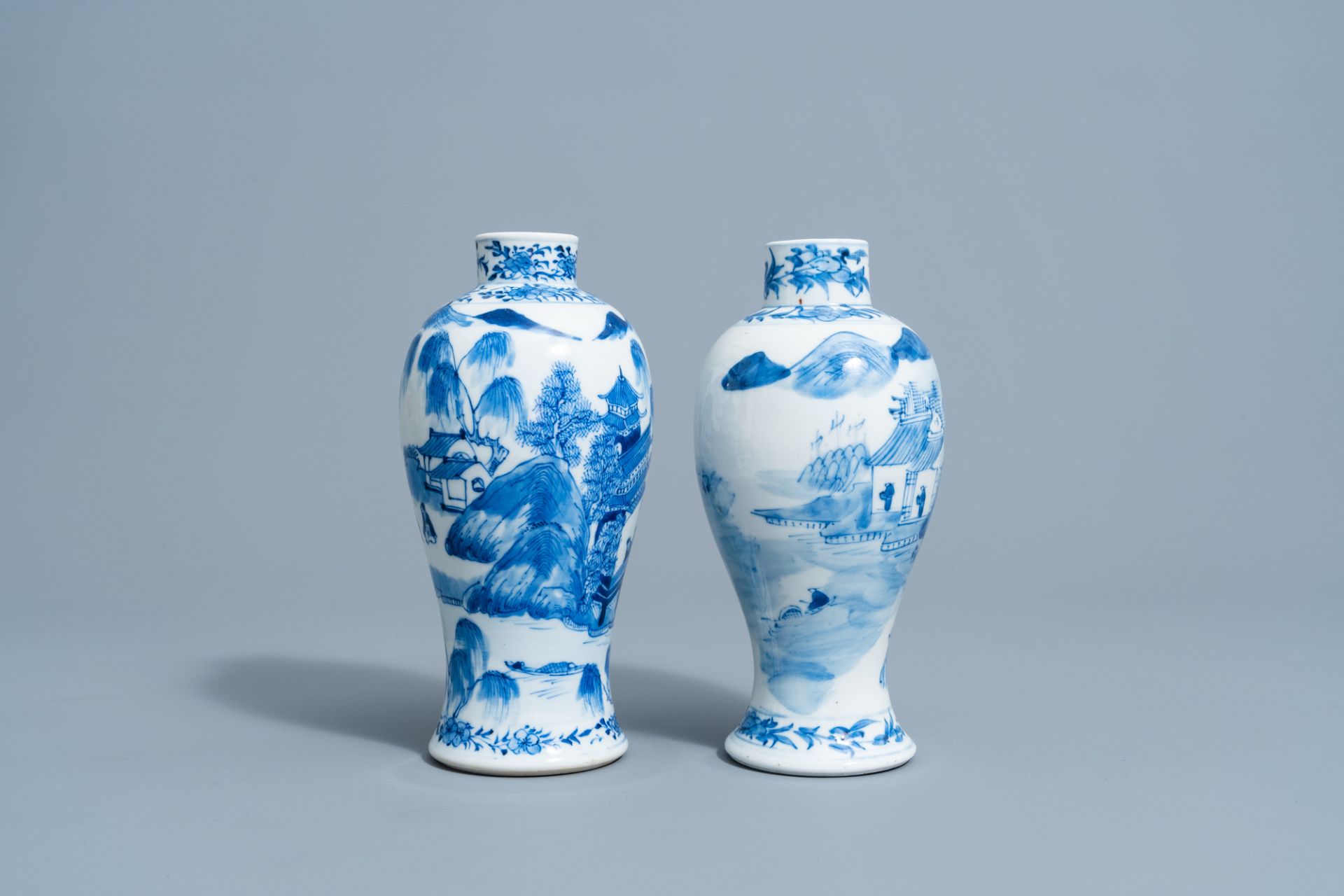 Two Chinese blue & white baluster vases with a mountain landscape, Kangxi mark, 19th C. - Image 4 of 6