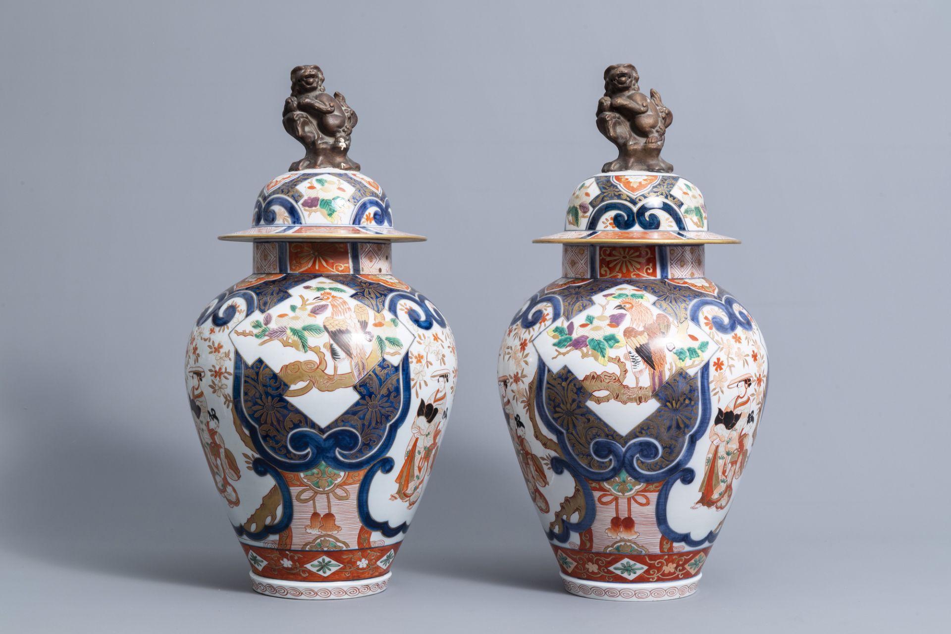 A pair of French Samson Imari style vases and covers with birds among flower branches and figures, 1