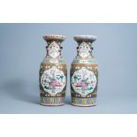 A pair of Chinese famille rose vases with antiquities and relief design, 19th C.
