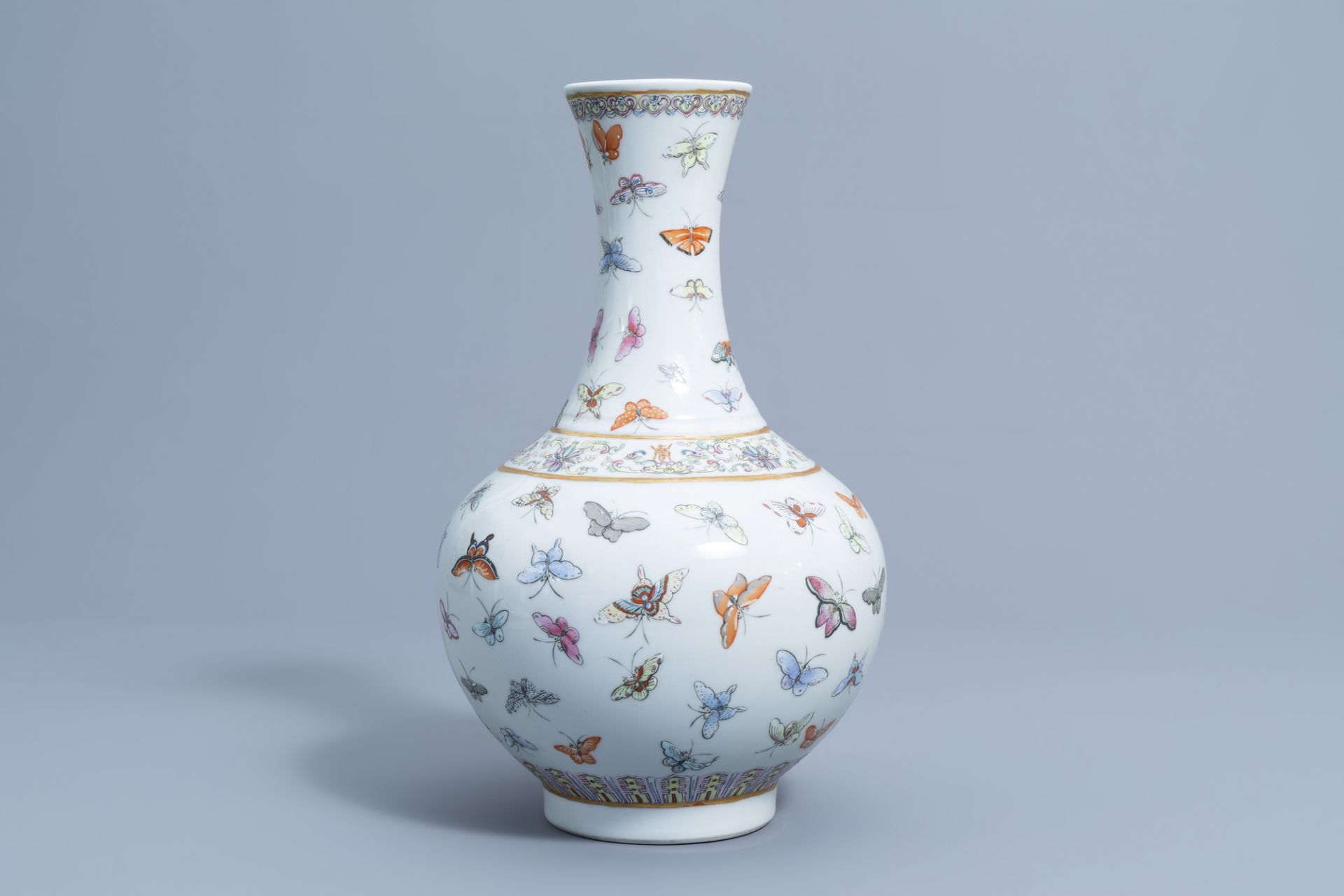 A Chinese famille rose '100 butterflies' bottle vase, Guangxu mark, 20th C.