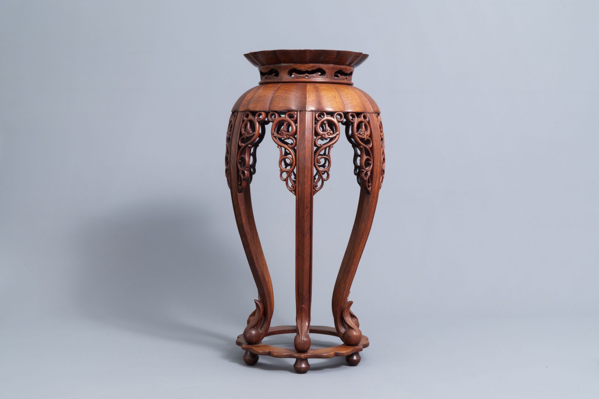 A Chinese carved wood stand with lotus shaped top, 20th C. - Image 2 of 7