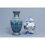 A Chinese wucai vase and cover with figurative design and a cloisonne vase with floral design, 19th/