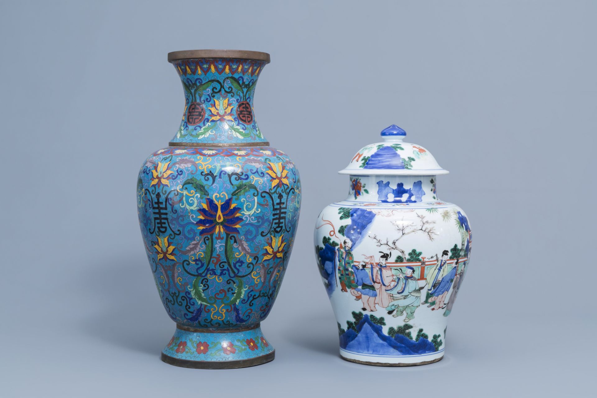 A Chinese wucai vase and cover with figurative design and a cloisonne vase with floral design, 19th/