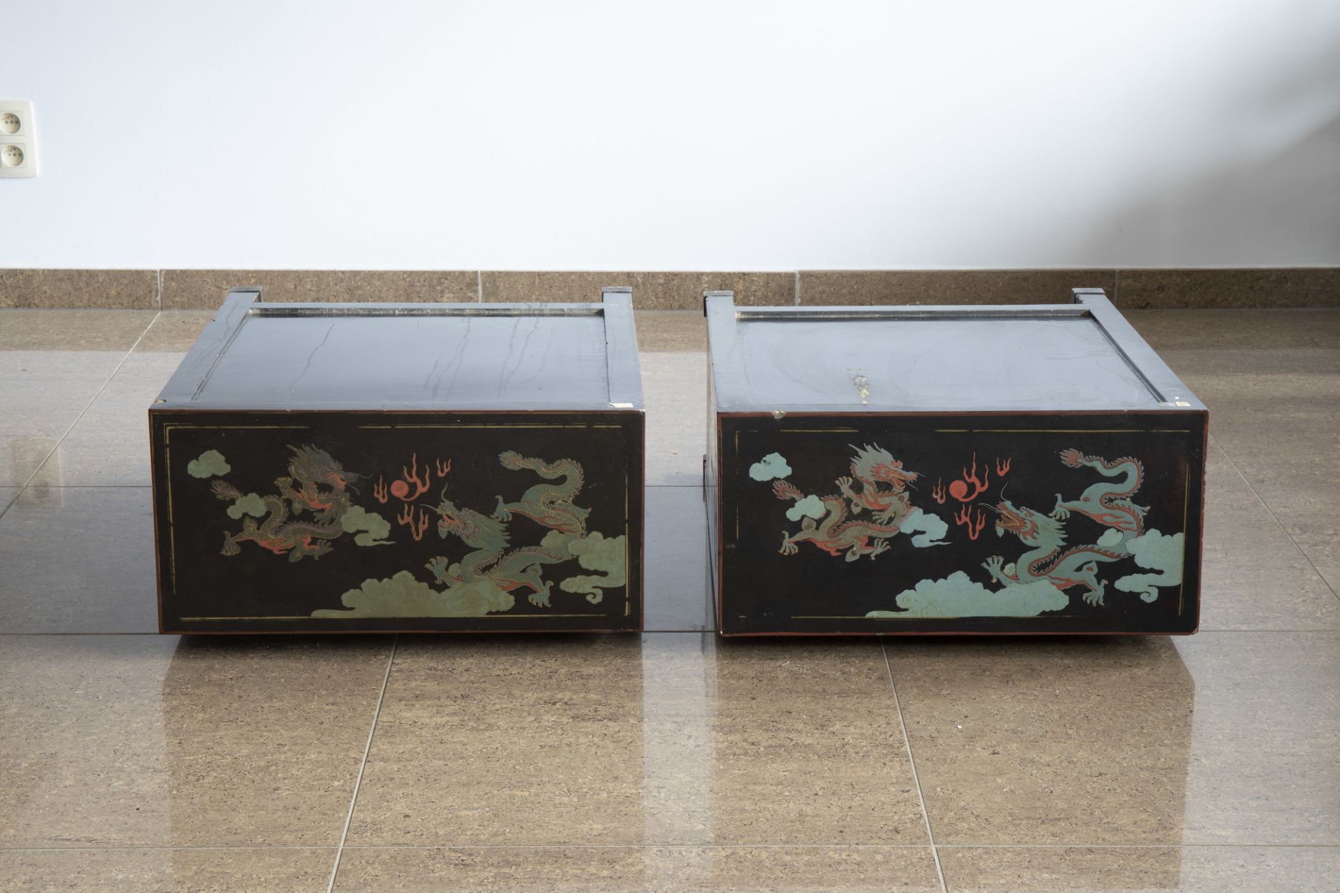 A pair of Chinese black lacquered wooden 'dragons chasing the pearl' two-door cabinets, 20th C. - Image 6 of 7