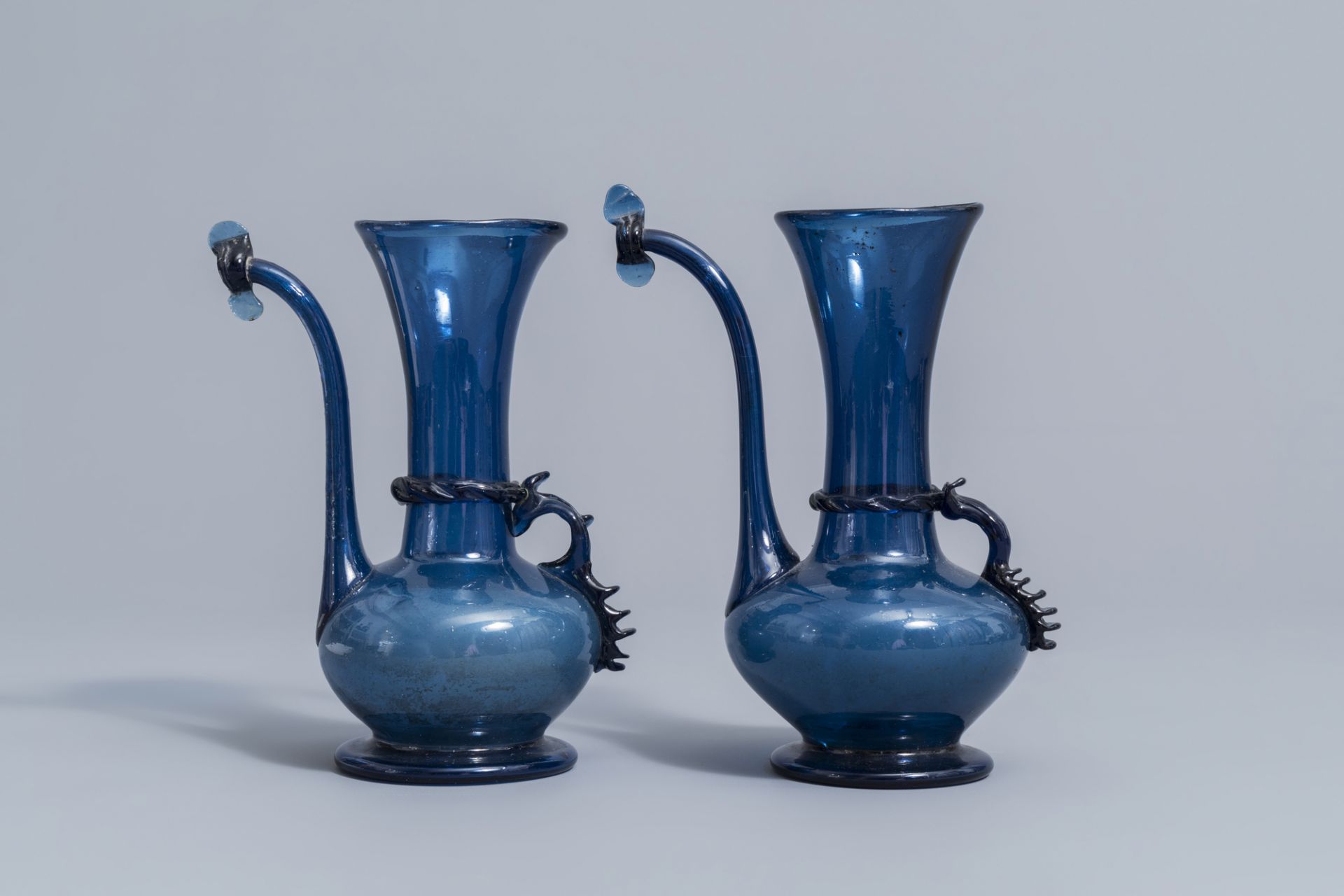 A pair of Islamic blue coloured relief decorated glass ewers or rosewater sprinklers, Qajar, Iran, 1 - Image 4 of 10