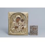 Two Russian 'Mother of God' icons with silver and copper oklad or riza, 19th/20th C.