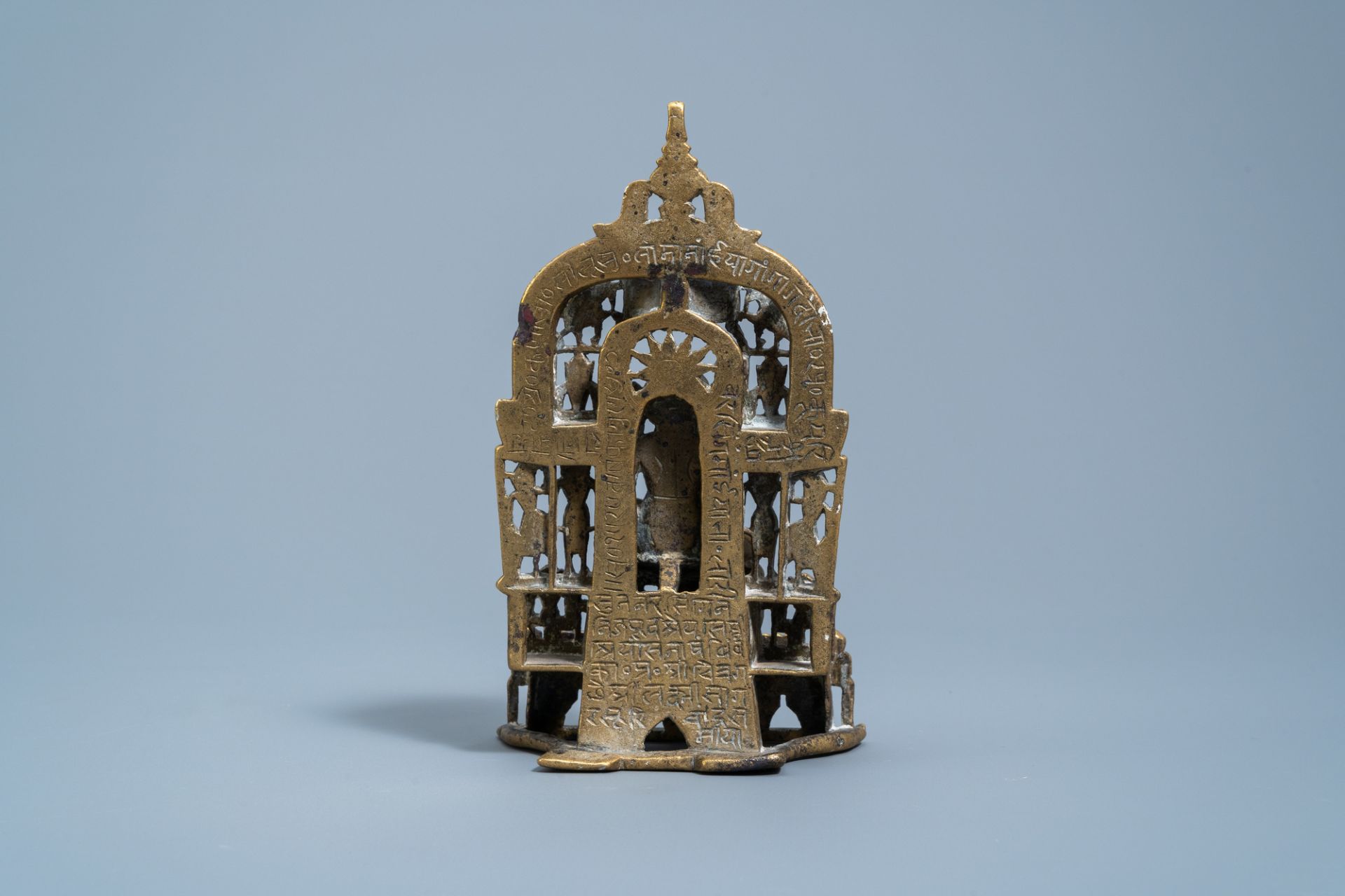 An Indian silver inlaid and inscribed bronze Jain shrine, 19th C. or older - Image 4 of 7