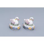 A pair of Dutch Delft tureens and covers in the shape of a swan on a nest, 19th C.