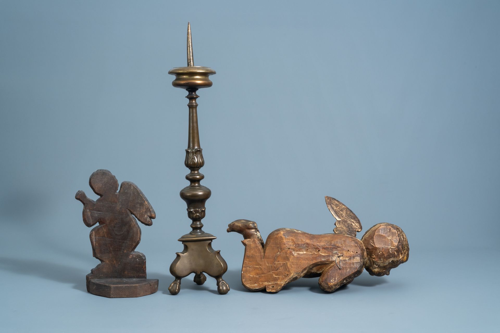 A patinated bronze pricket candlestick, a gilt wooden angel and a polychrome painted dummy board wit - Image 3 of 6