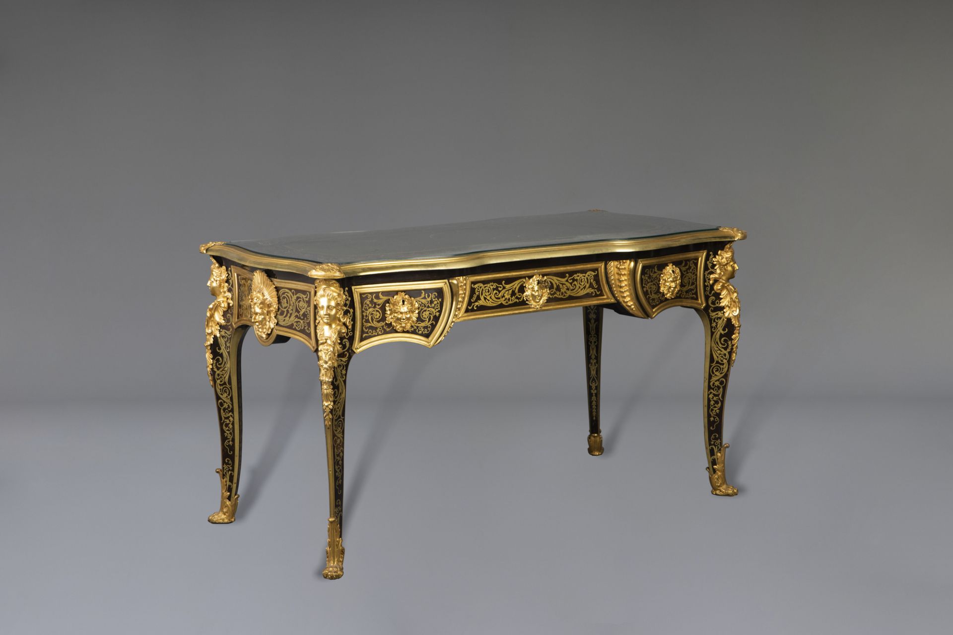 An impressive French gilt bronze mounted brass and tortoiseshell inlaid ebonized bureau plat, Befort