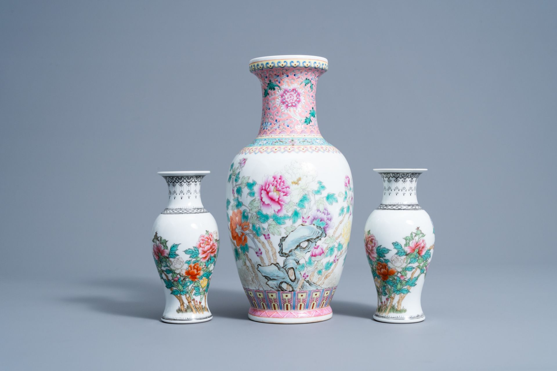 A pair of Chinese famille rose vases and a vase with floral design, 20th C. - Image 2 of 7