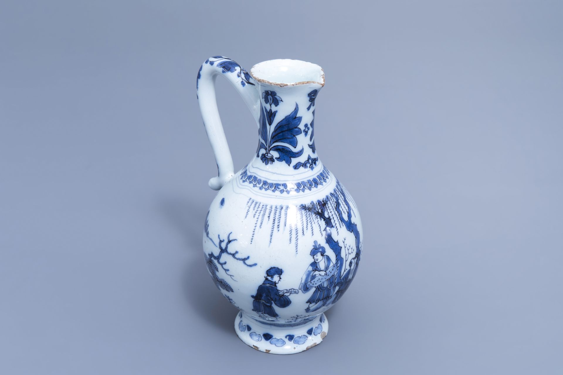 A Dutch Delft blue and white chinoiserie jug, 17th C.