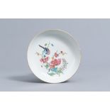 A Chinese famille rose dish with a bird among blossoming branches, Yongzheng