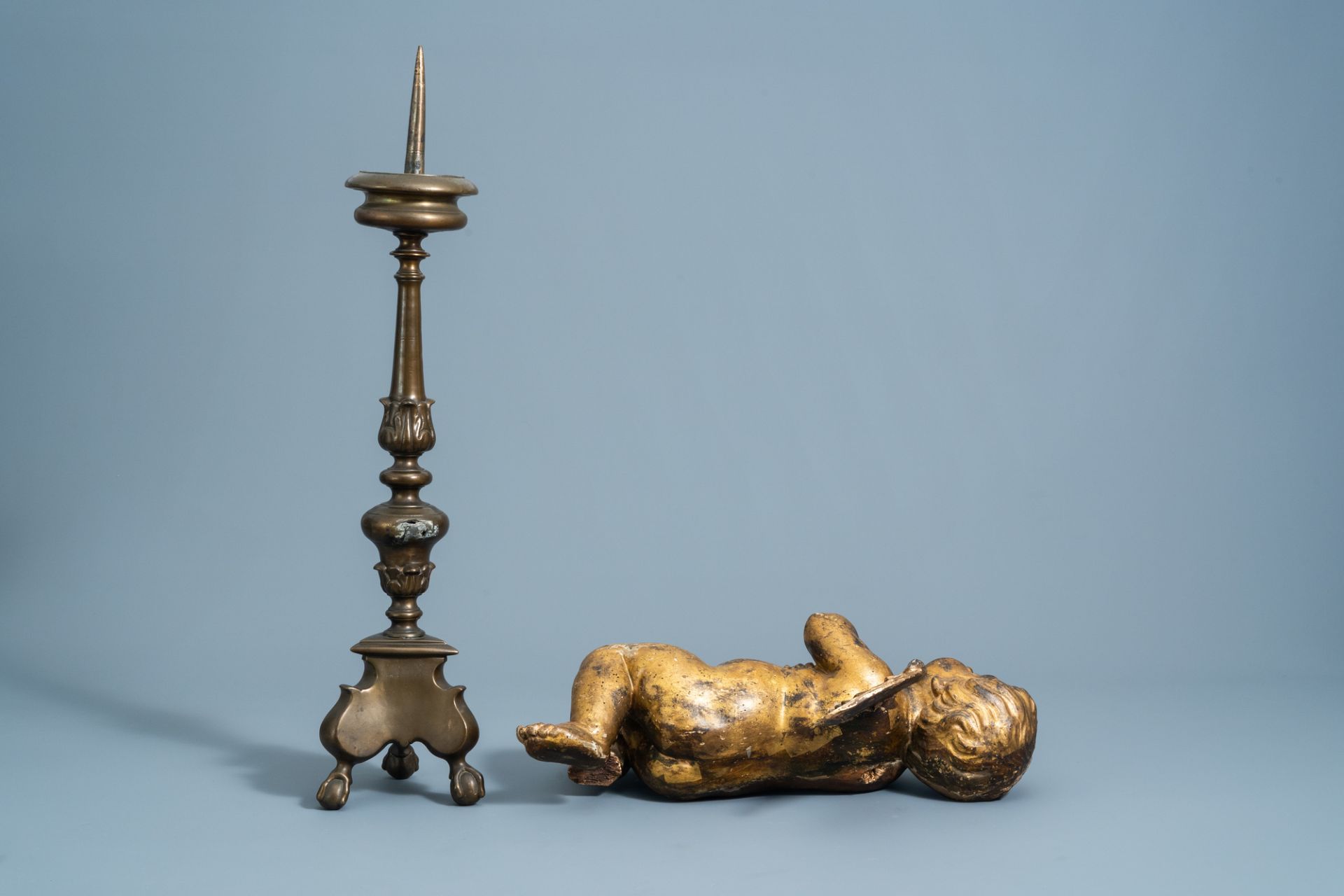 A patinated bronze pricket candlestick, a gilt wooden angel and a polychrome painted dummy board wit - Image 4 of 6