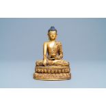 A Chinese turquoise inlaid gilt bronze figure of Buddha with an inscription, 20th C.