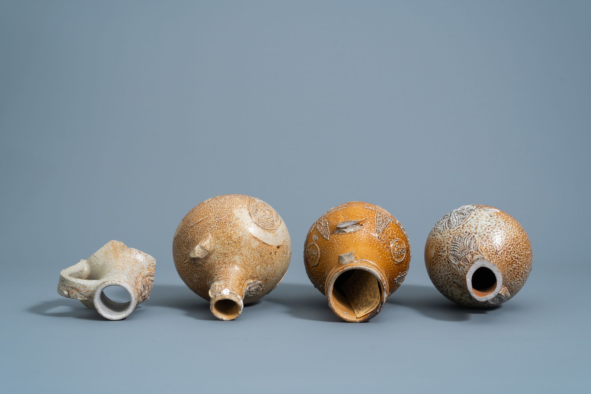 Three German stoneware bellarmine jugs and a neck fragment, 16th/17th C. - Image 7 of 8
