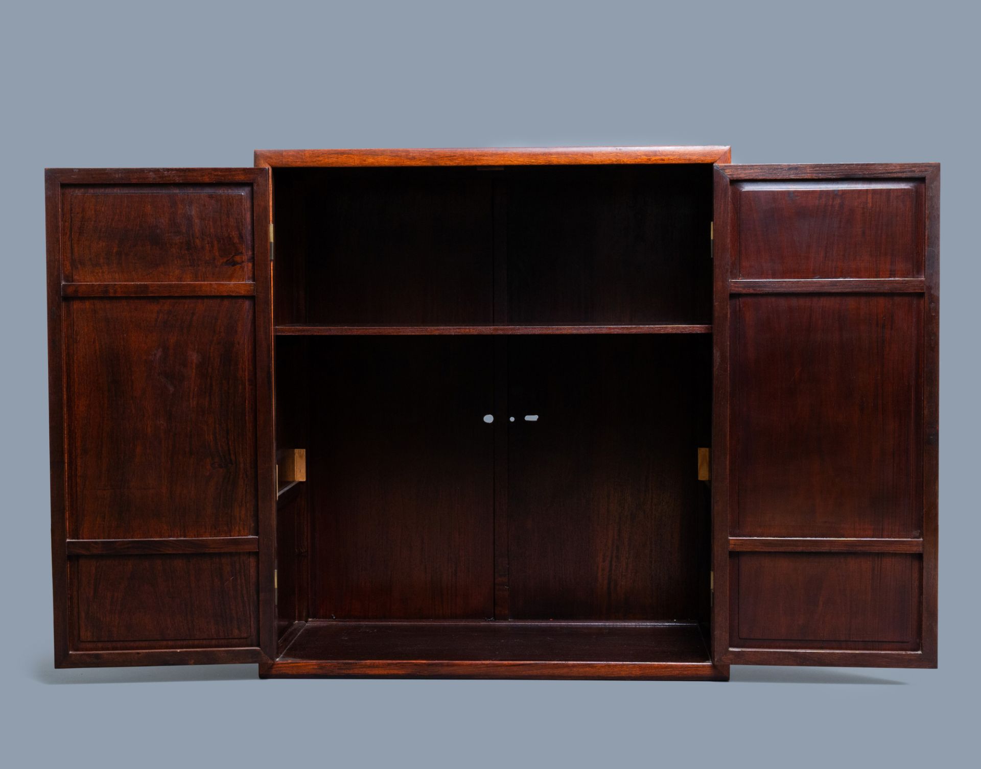 A Chinese wooden two-door cupboard with carved floral panels, 19th C. - Image 12 of 12