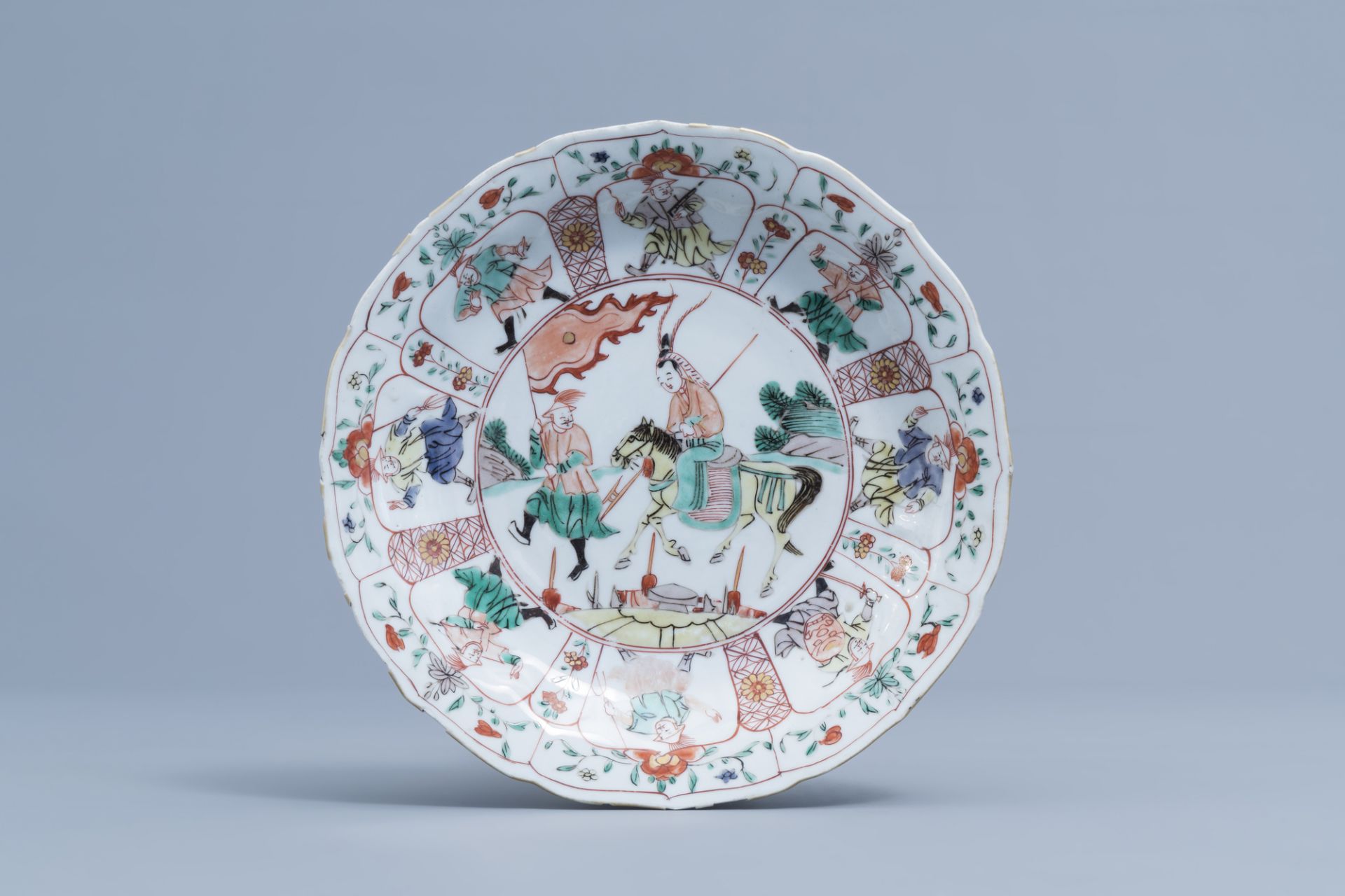 A Chinese lotus shaped famille verte 'Mu Guiying' dish, Kangxi