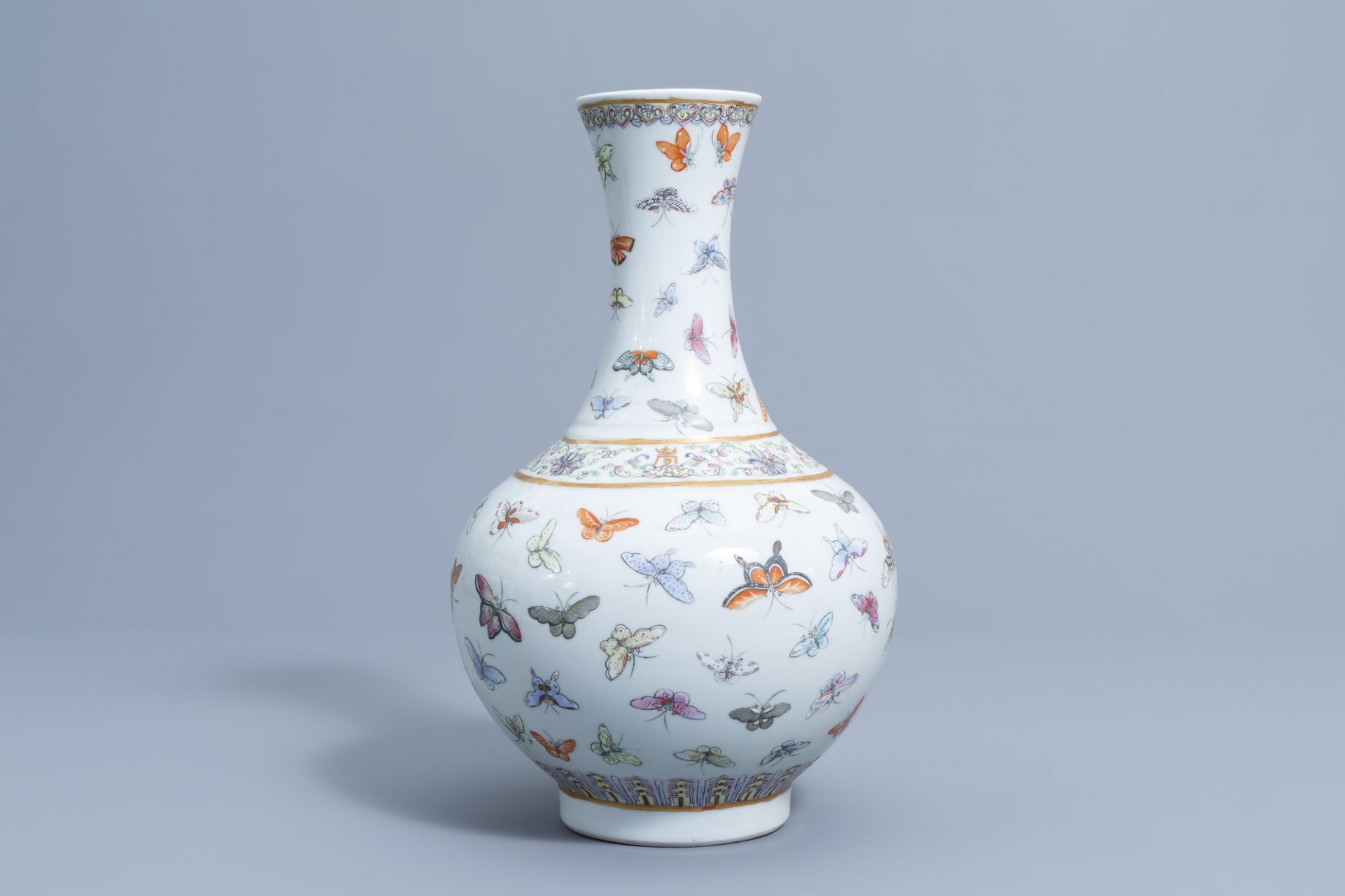 A Chinese famille rose '100 butterflies' bottle vase, Guangxu mark, 20th C. - Image 4 of 7