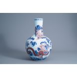 A large Chinese blue, white and copper red bottle shaped 'dragon' vase, Qianlong mark, 19th/20th C.