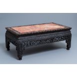 A Chinese mother-of-pearl inlaid wooden low side table with marble top, 19th C.