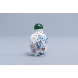 A Chinese famille rose snuff bottle with figures in a garden, Qianlong mark, 19th/20th C