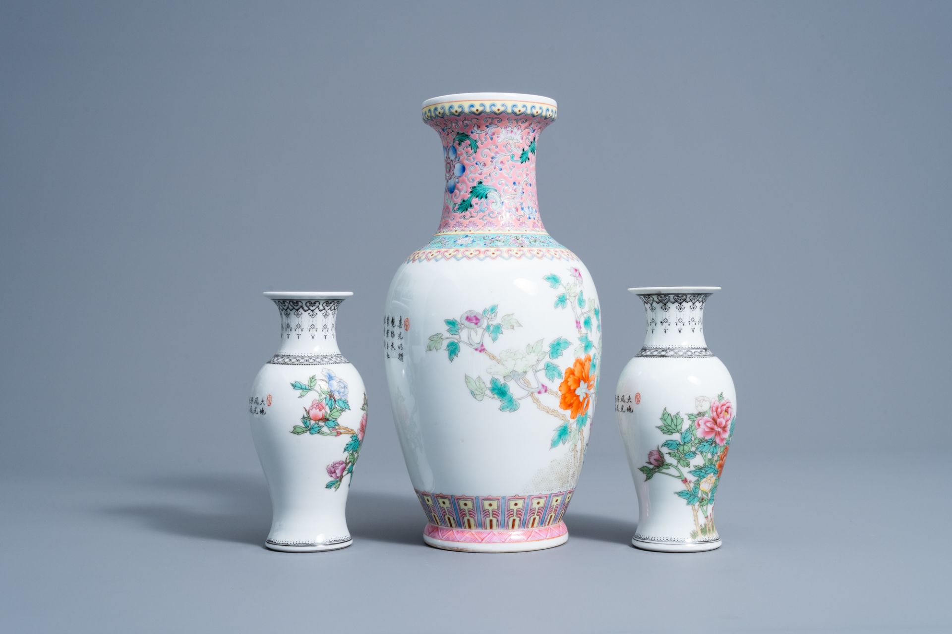 A pair of Chinese famille rose vases and a vase with floral design, 20th C. - Image 5 of 7