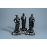 A Chinese bronze group of three figures, seal mark, Ming