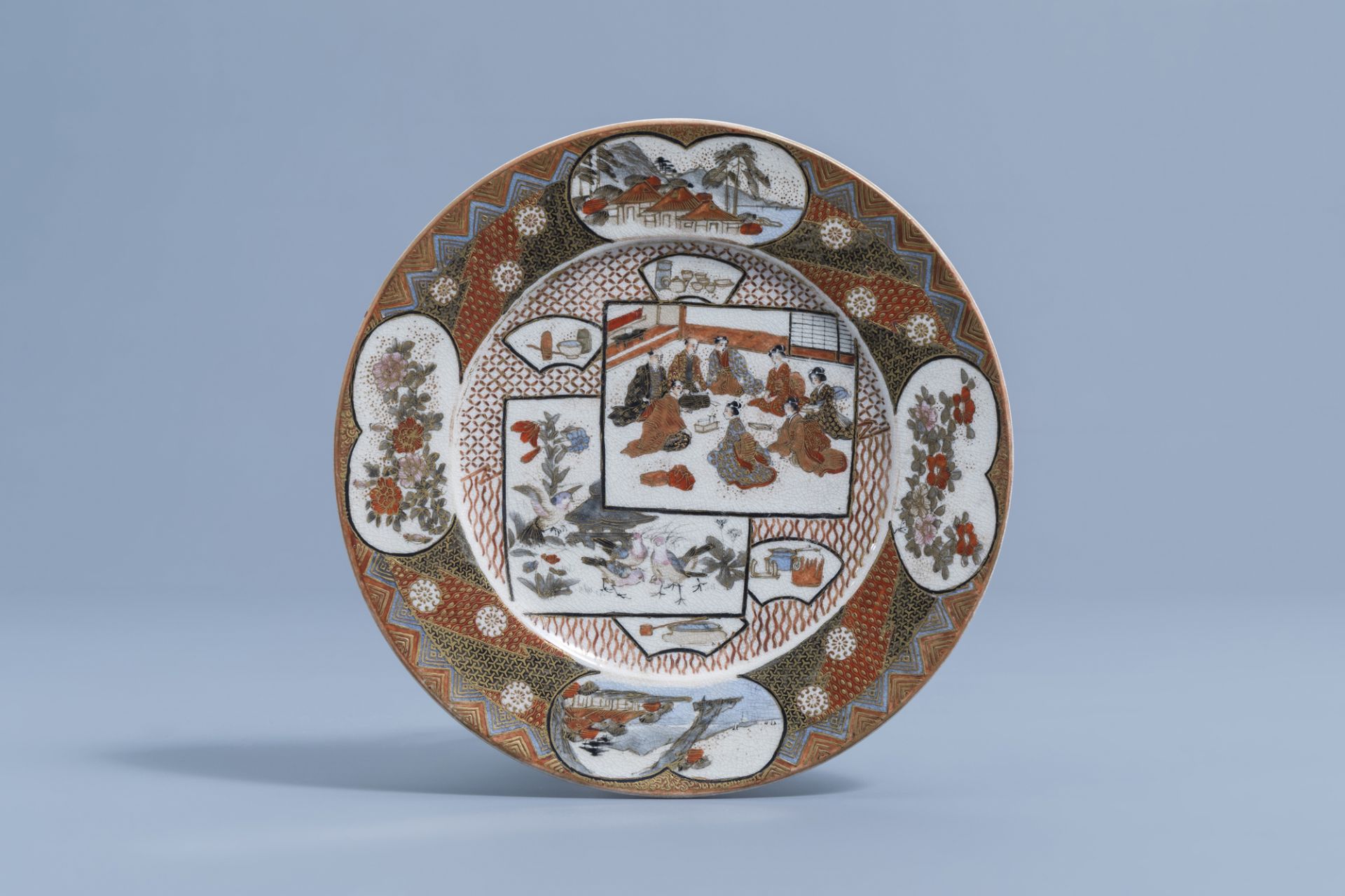 A Japanese Satsuma saucer dish with different designs, signed Kozan, Meiji, 19th C.