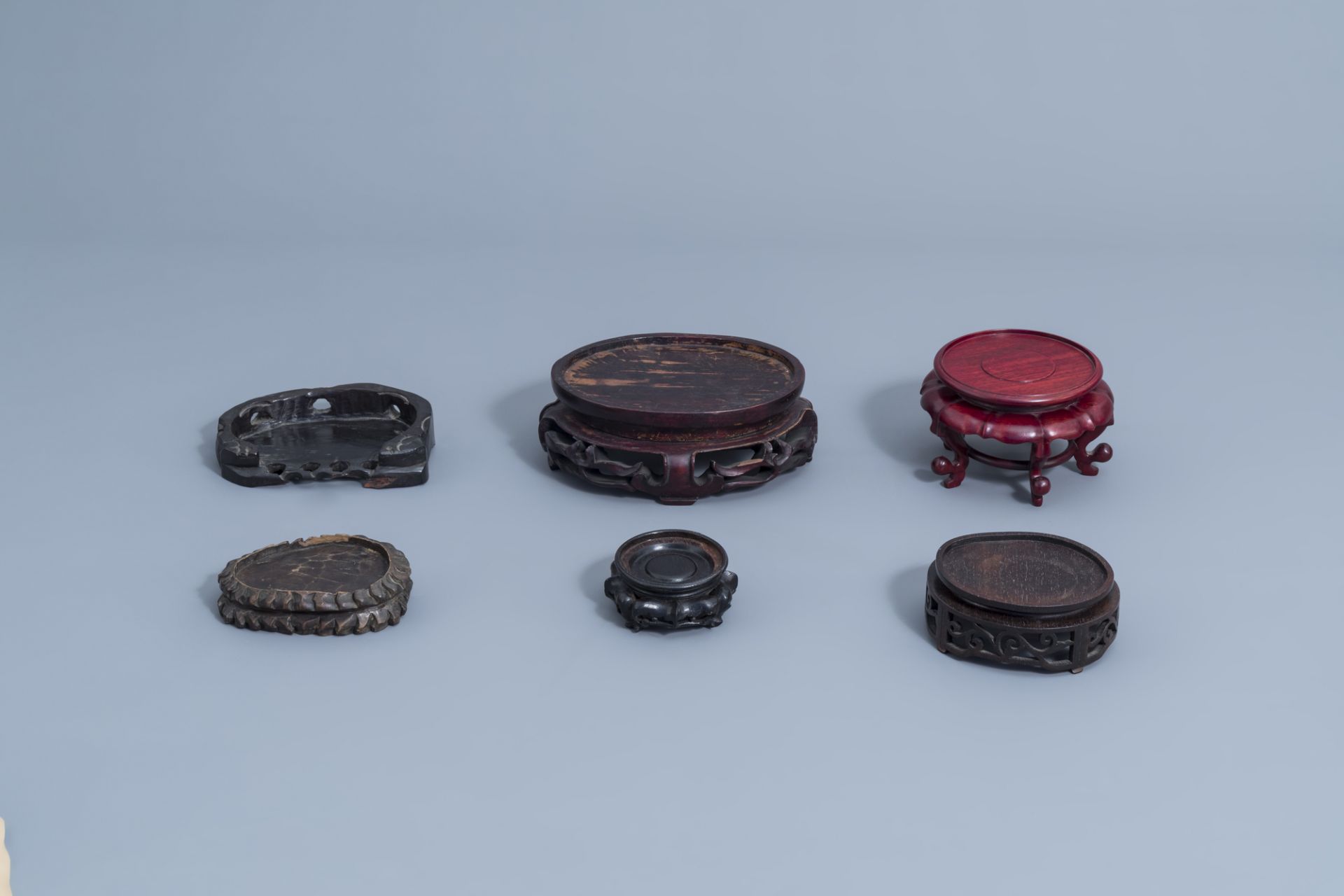 A collection of Chinese carved wooden stands, 19th/20th C. - Image 22 of 25