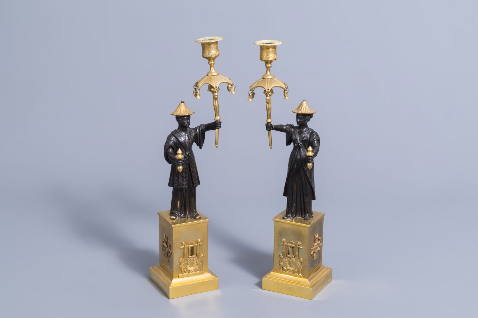 An extraordinary pair of French Empire style patinated bronze and ormolu chinoiserie candelabra, ear