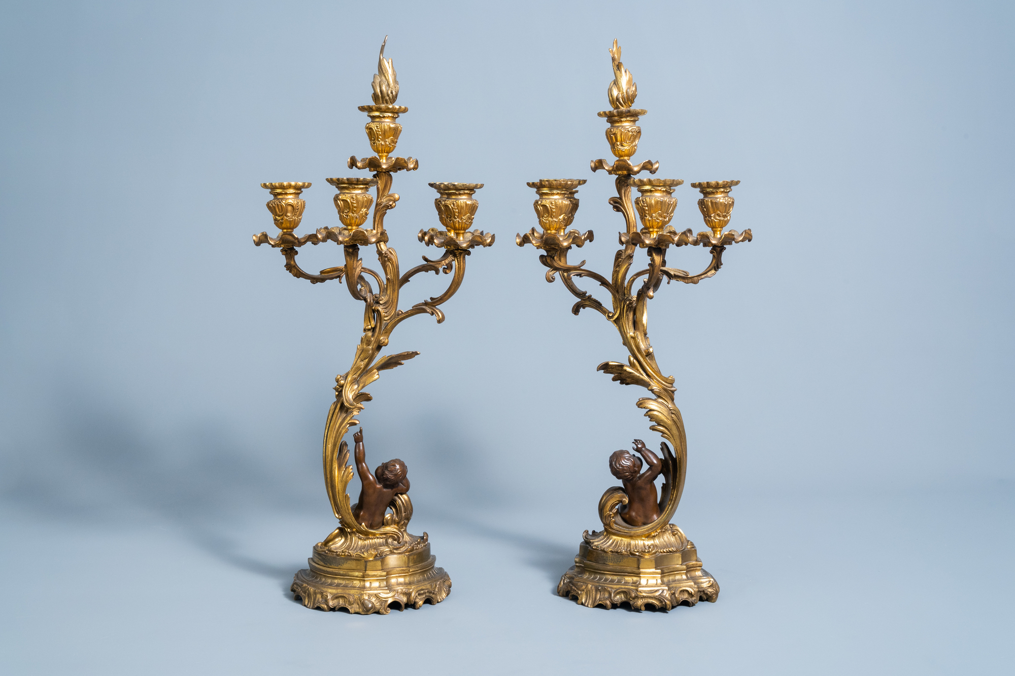 A pair of French gilt and patinated bronze Louis XV style five-light candelabra, 19th/20th C. - Image 2 of 4