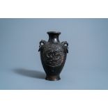 A Chinese bronze 'dragon' medallion vase, six-character mark, Ming/Qing