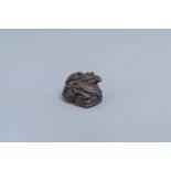 A Japanese wooden 'turtles' netsuke, signed, 20th C.