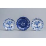 A pair of Dutch Delft blue and white 'tea tree' plates and a French plate with floral design, Saint-