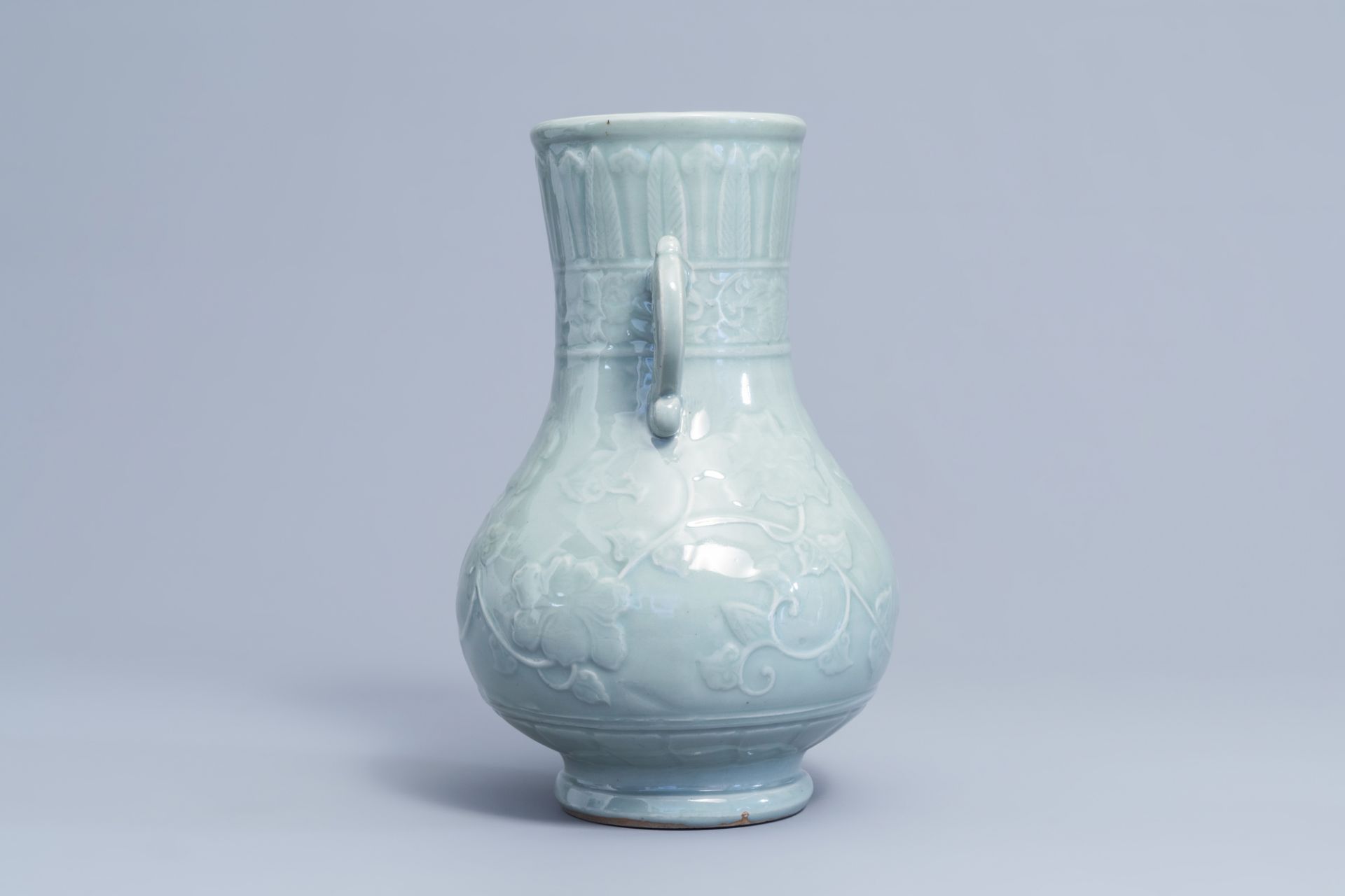 A Japanese celadon glazed 'lotus scroll' bottle vase, Edo/Meiji, 18th/19th C. - Image 4 of 6